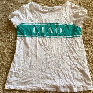 White shirt with the word, “Ciao” written.